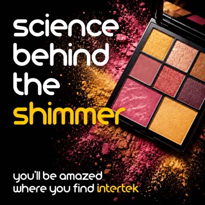A makeup case with colored makeup powder scattered around it