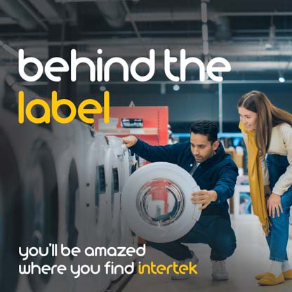 A couple examining a washing machine in a store